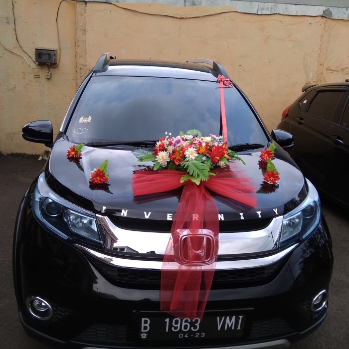 Dekorasi mobil pengantin pita